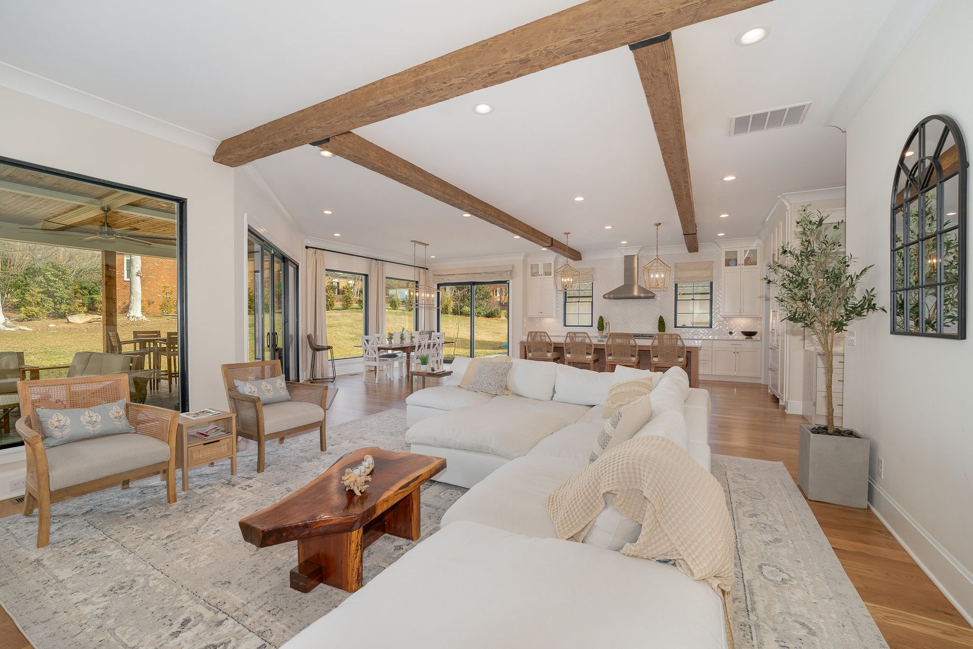 A living room with a couch, chairs, and a coffee table