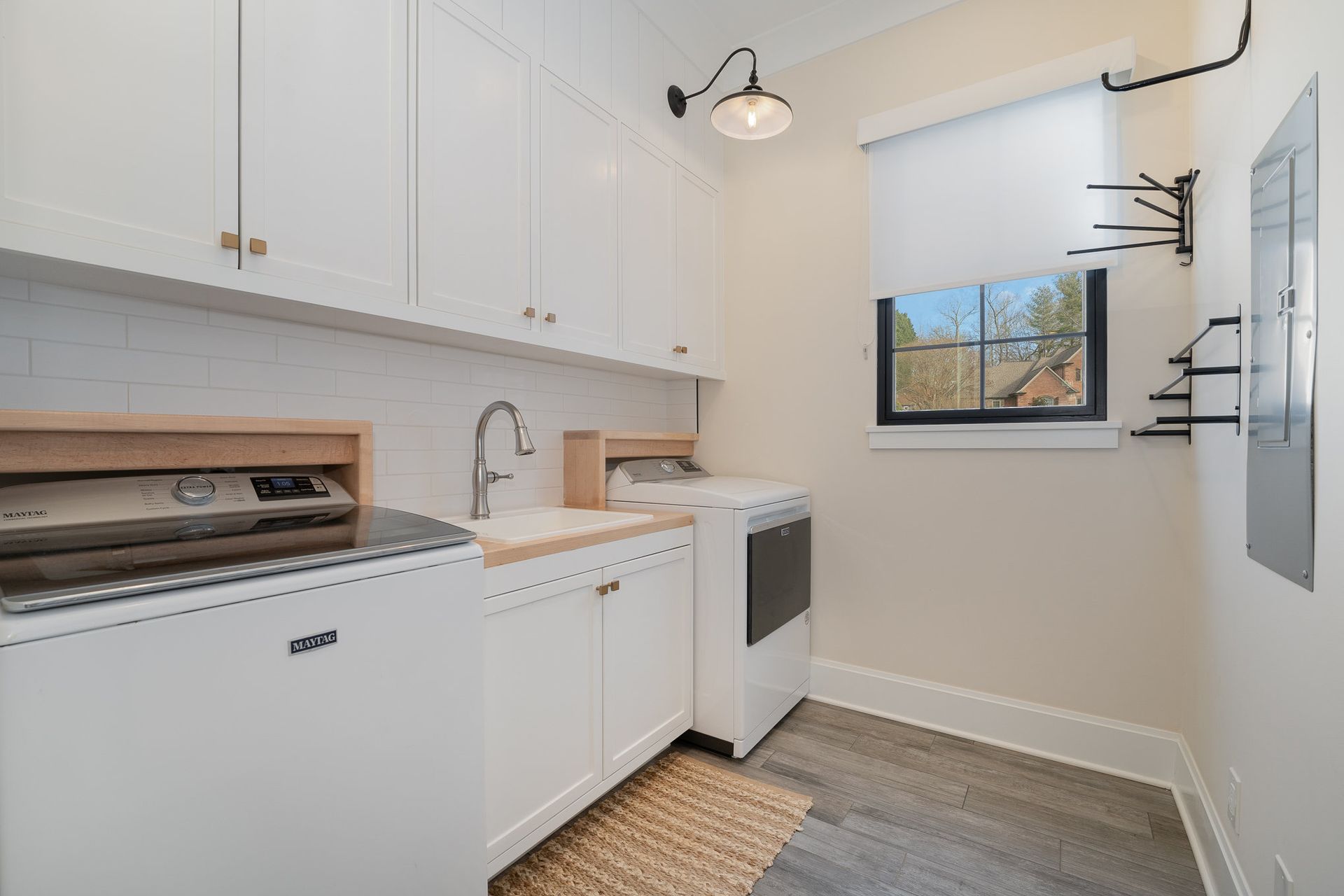A laundry room with a washer and dryer