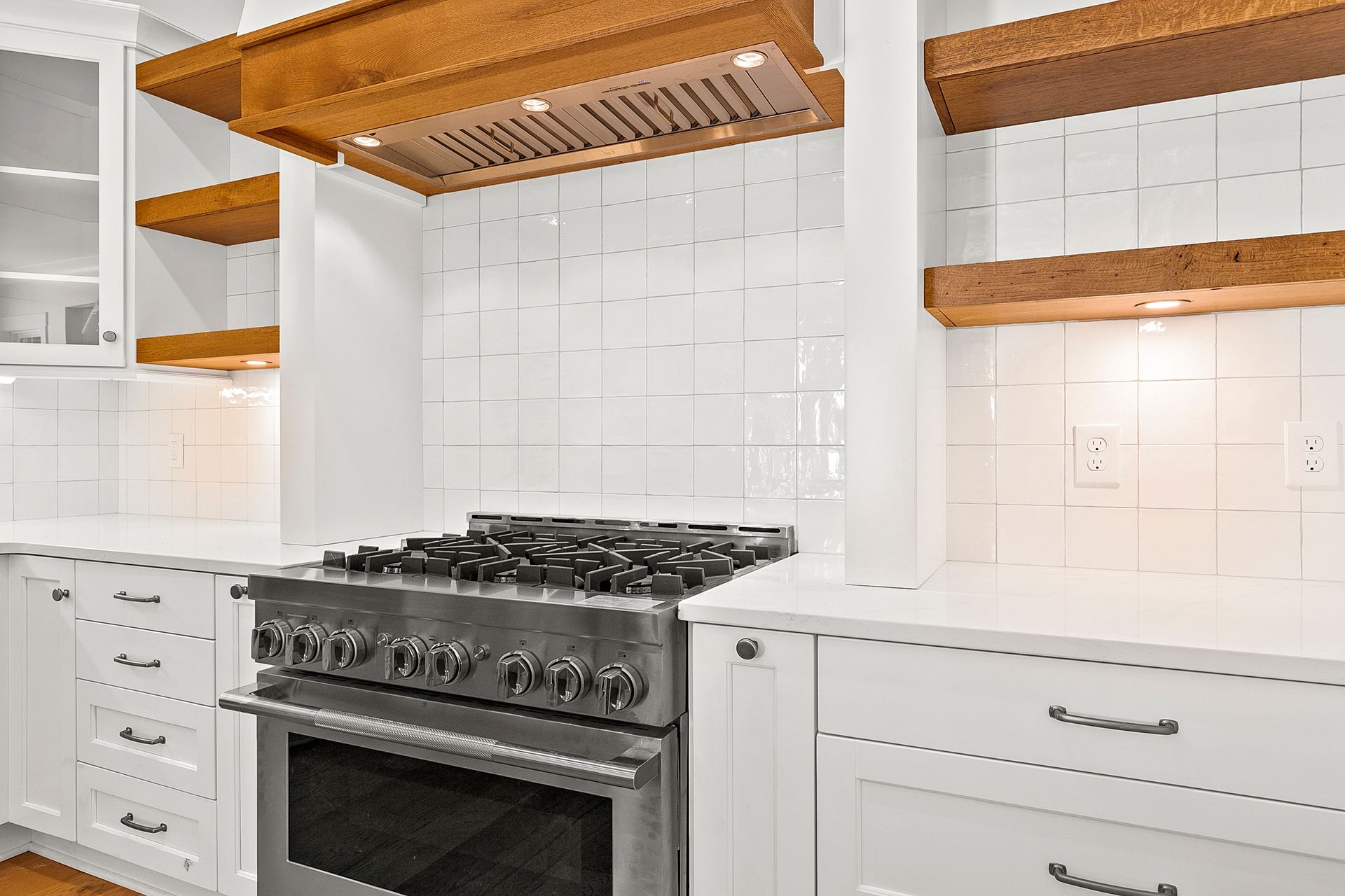 A kitchen with stainless steel stove