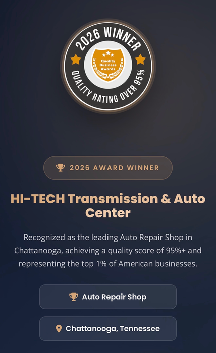 Dark blue ad for HI-TECH Transmission & Auto Center with award badge and location details