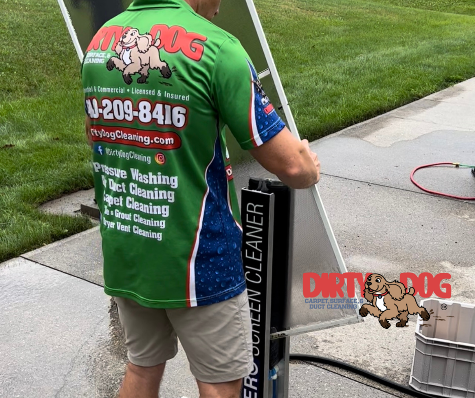 A man wearing a green shirt that says dirty dog