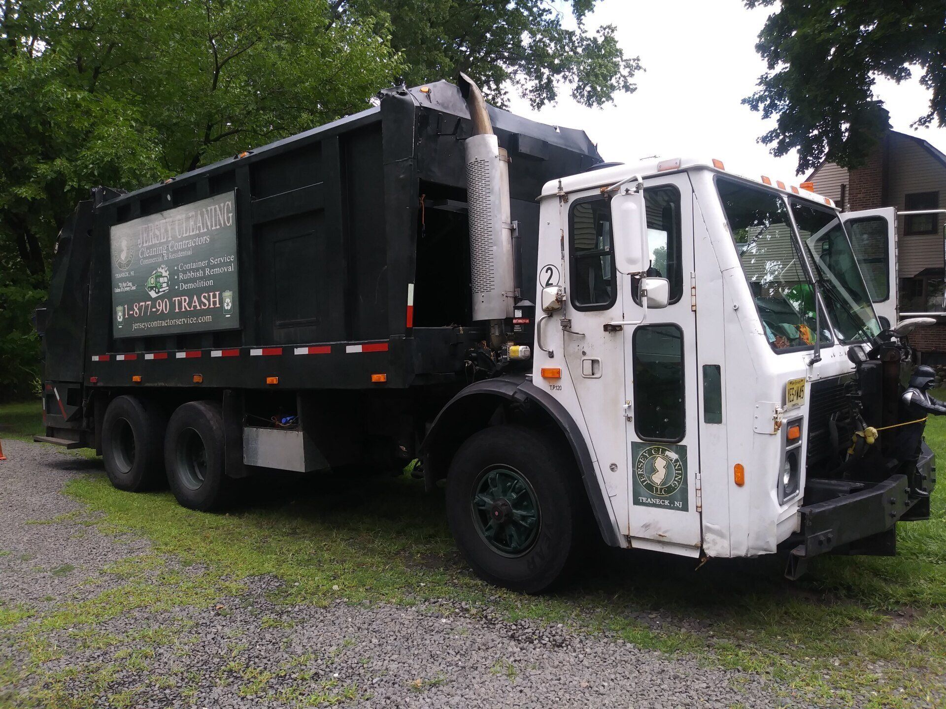 A garbage truck with the number 2 on it