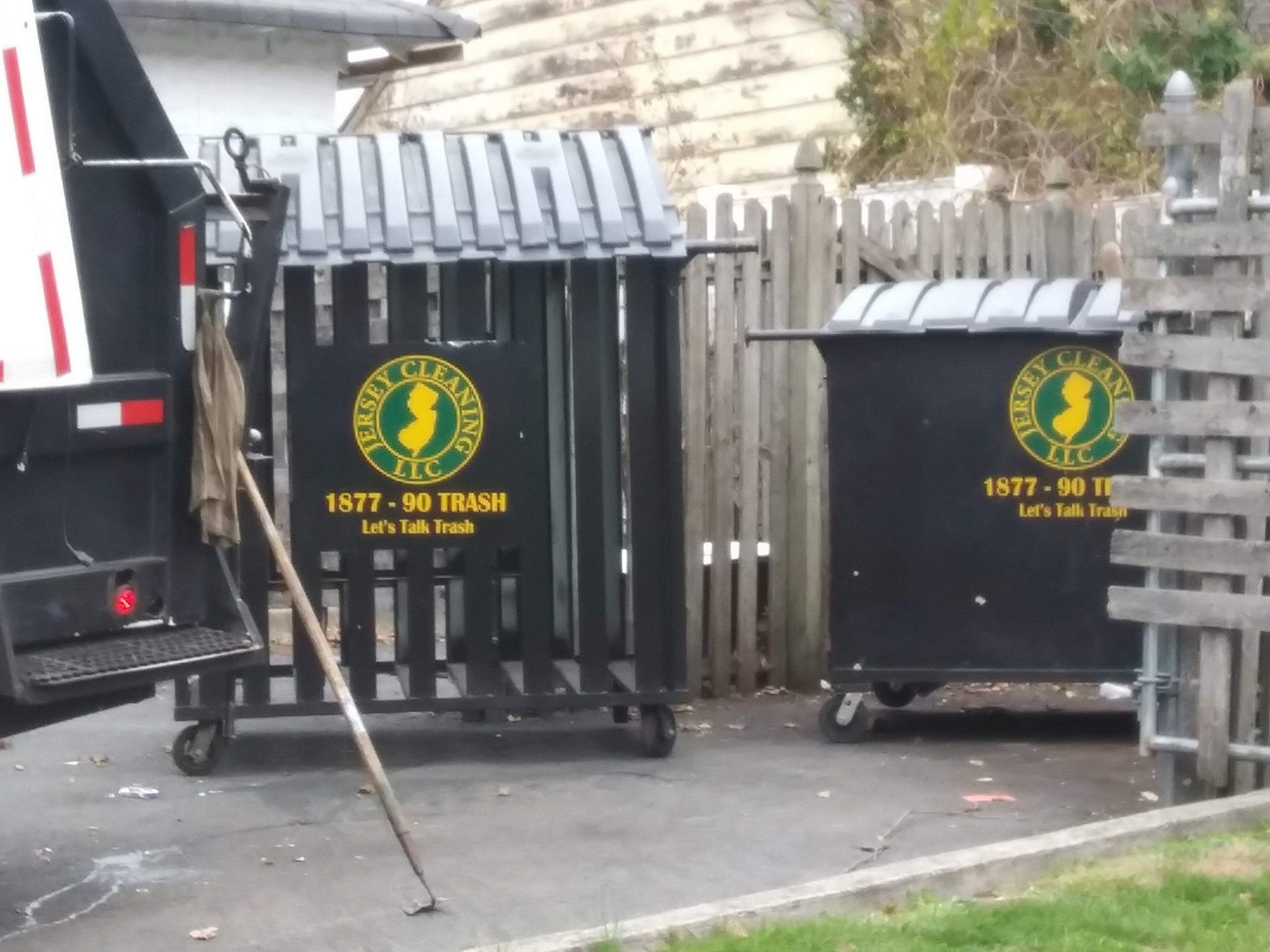 Two garbage cans from Jersey Cleaning LLC