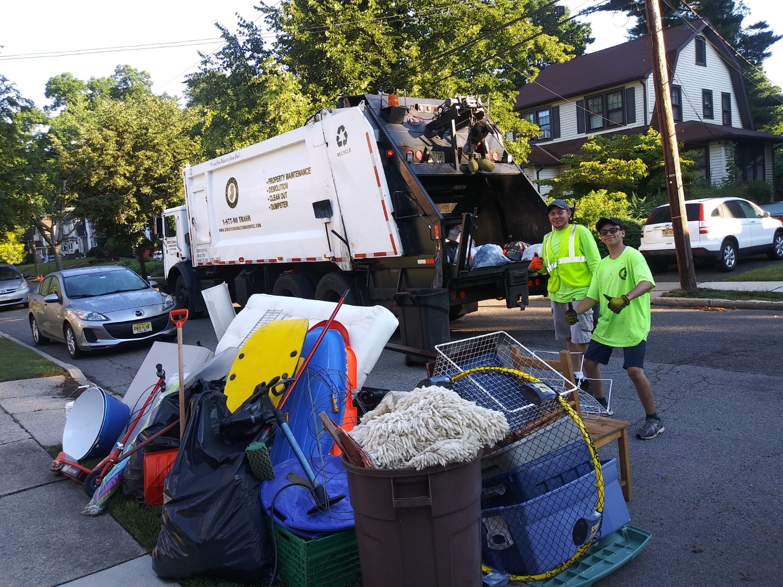 A Jersey Cleaning garbage truck and garbages.