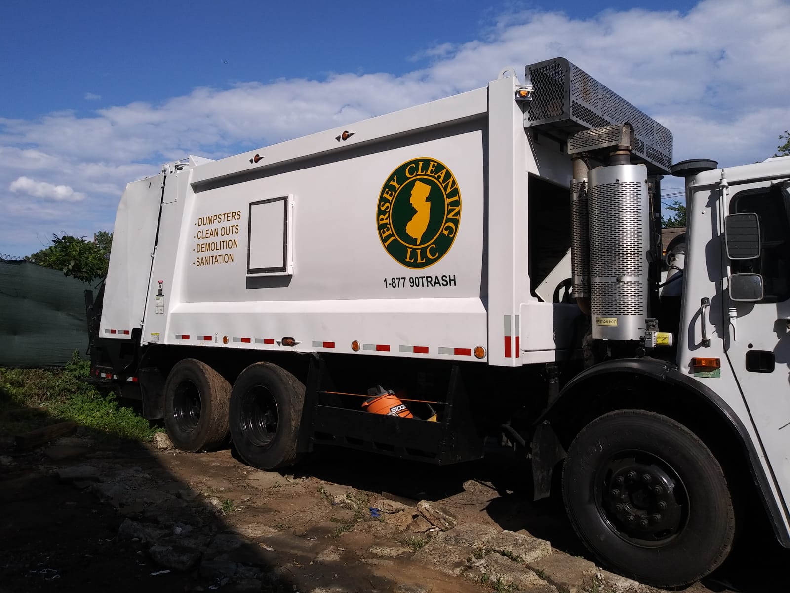 A Jersey Cleaning garbage truck and garbage.