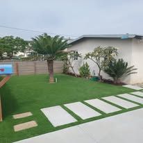 There is a mailbox in the middle of the yard.