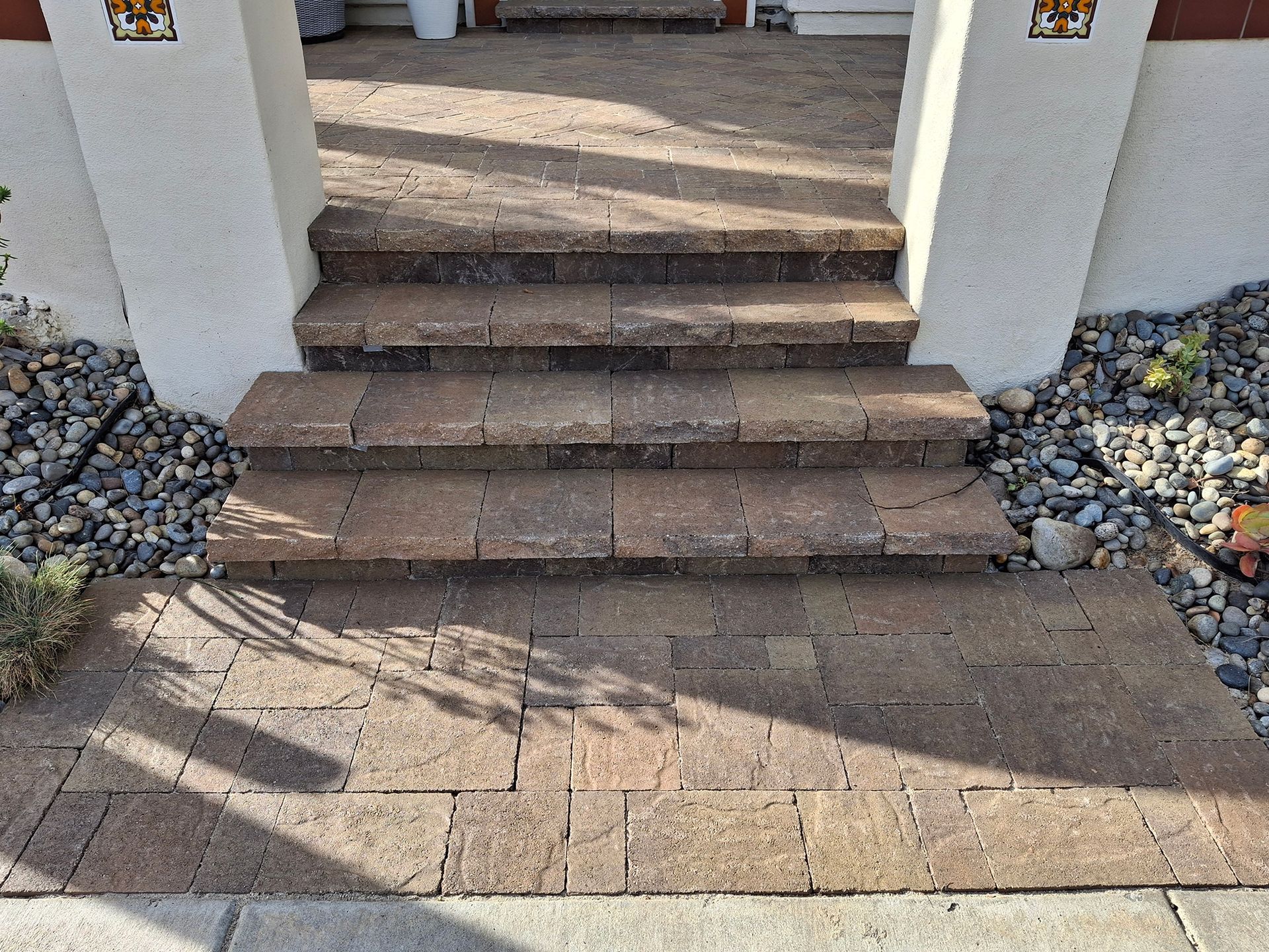 A set of brick steps leading up to a house.