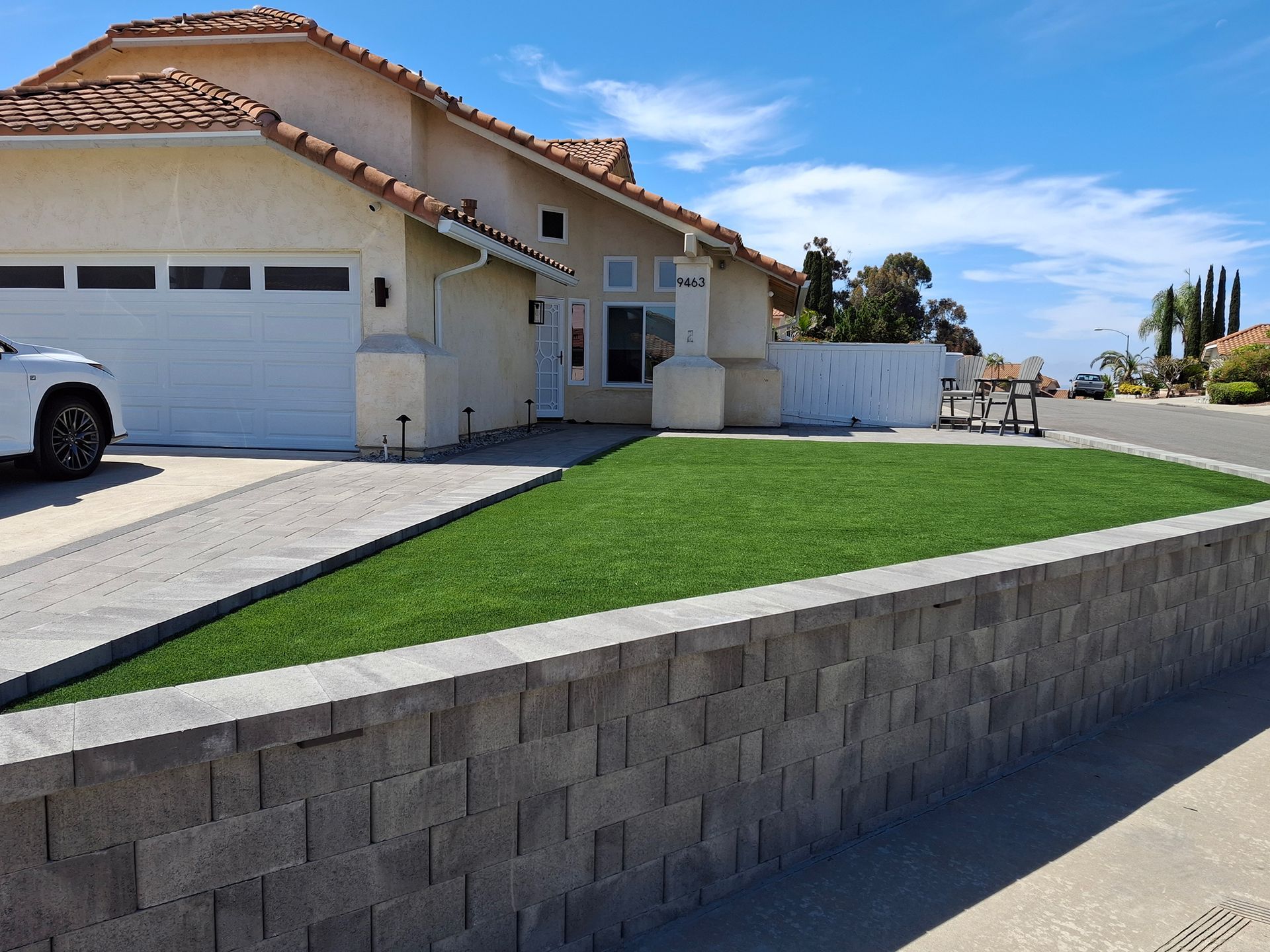 A house with a car parked in front of it