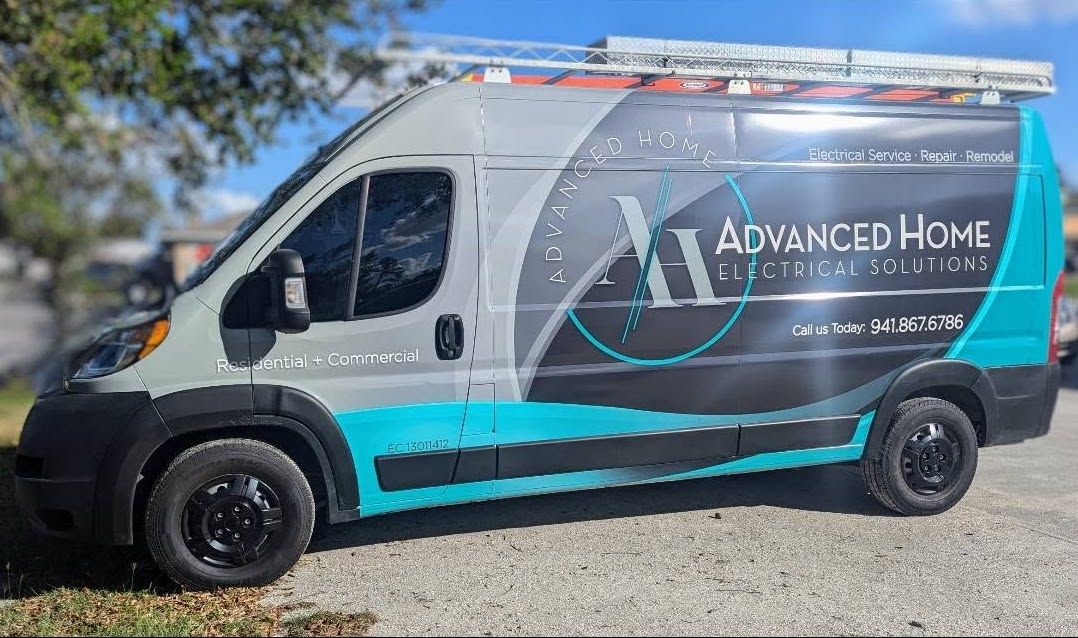 Black and gray service van with teal accents and ladder rack, parked outdoors on gravel.
