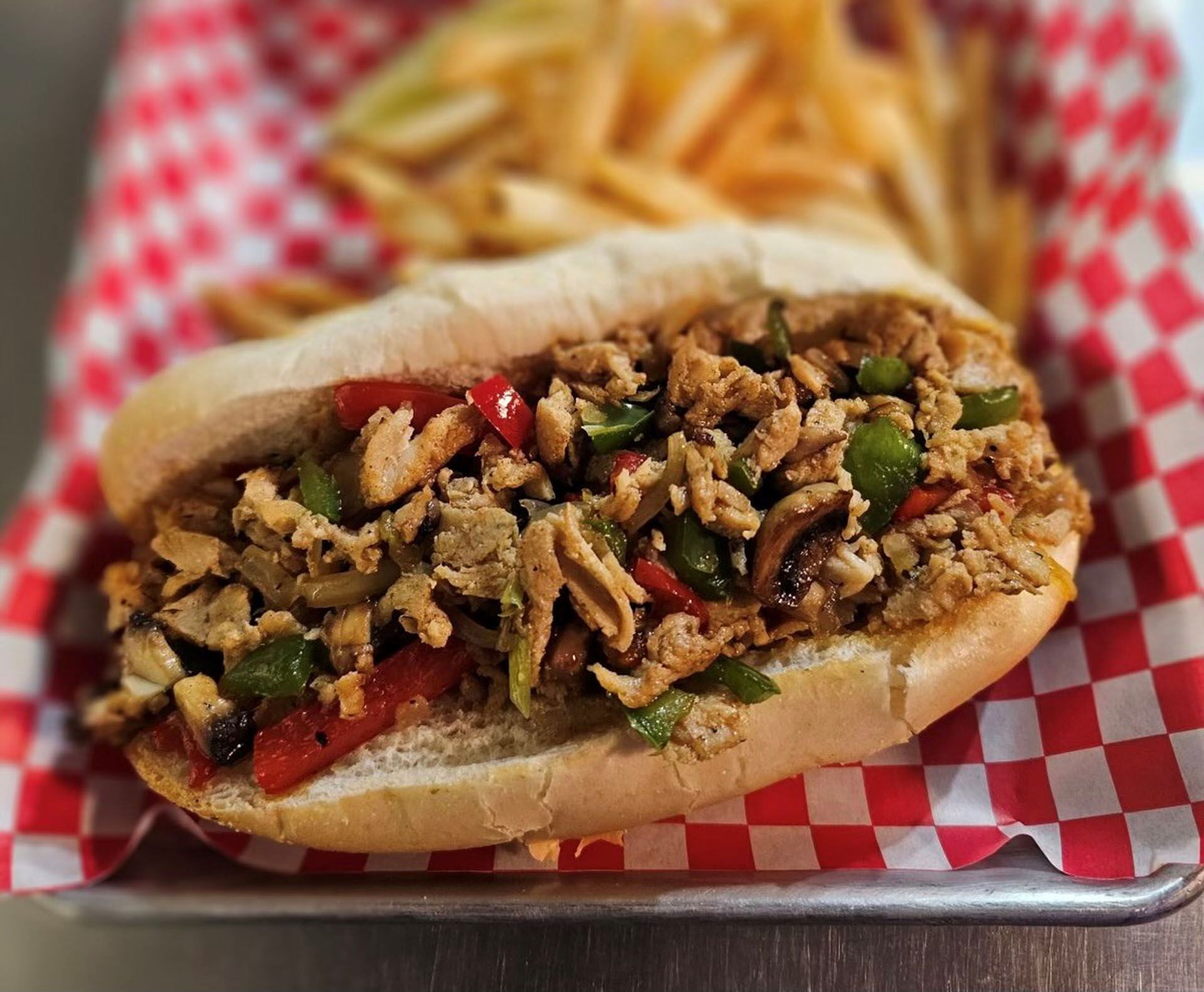 A sandwich and fries on on a tray