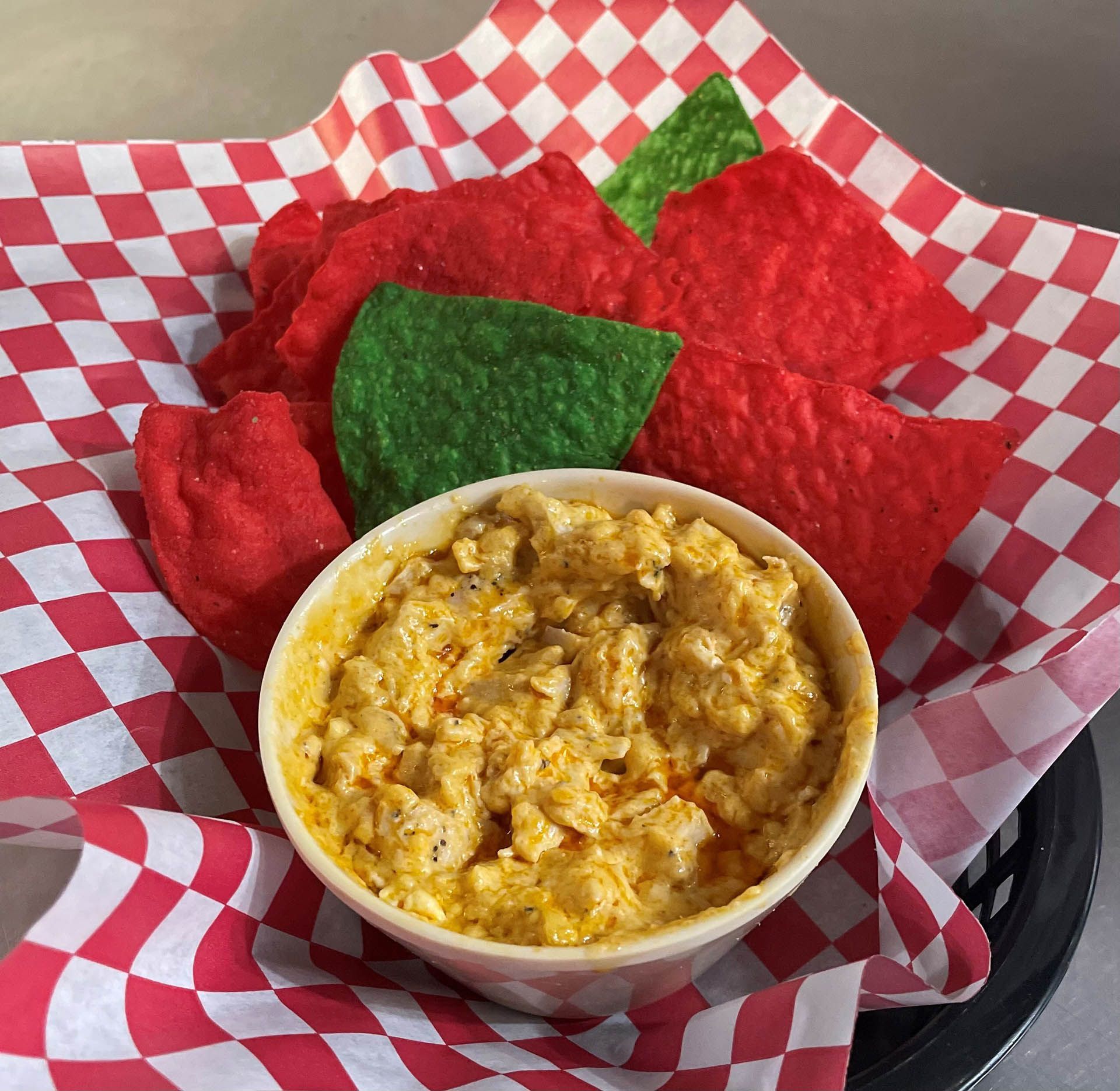 Colorful chips and a bowl of dip