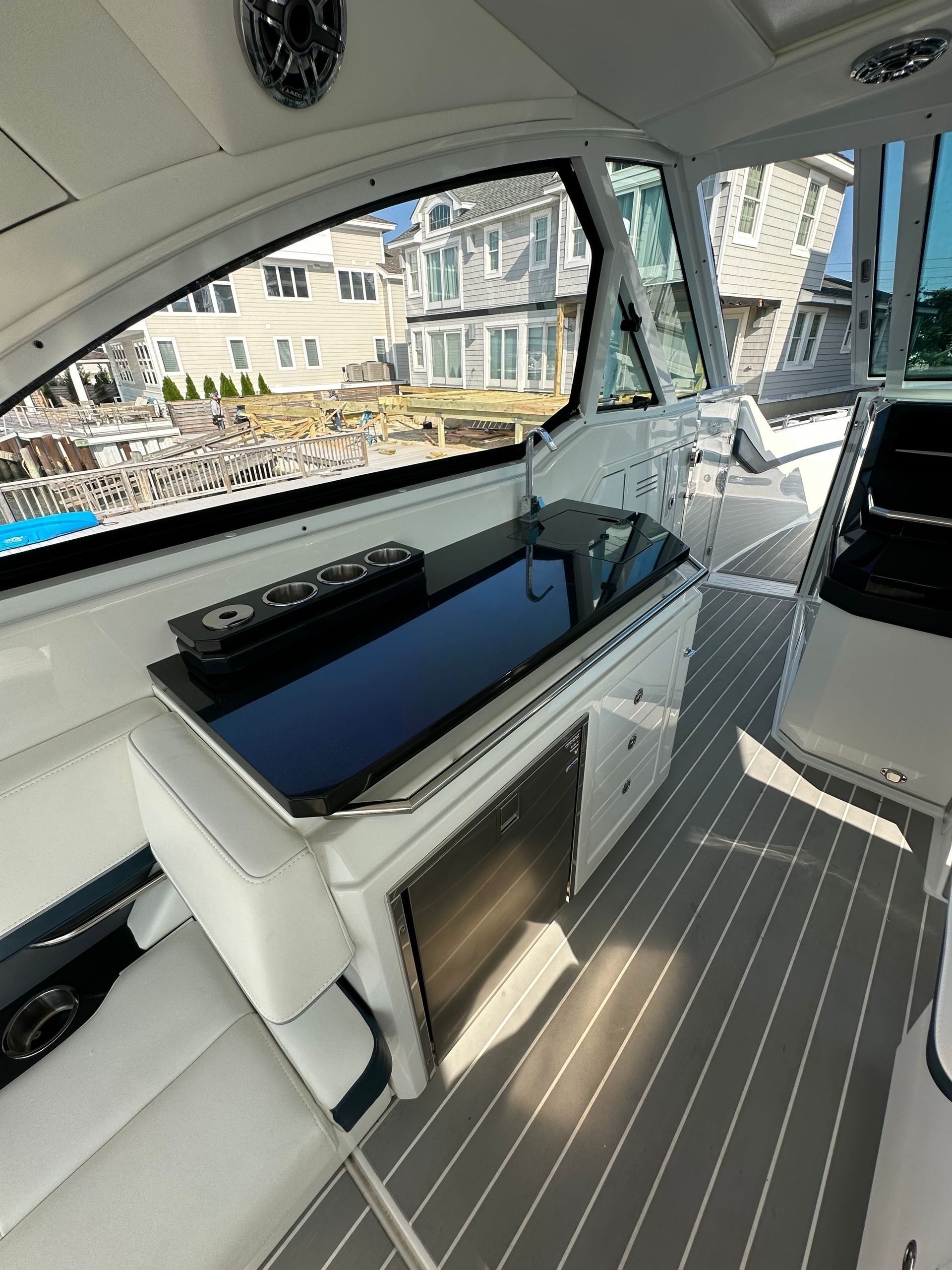 the inside of a boat with a black counter top