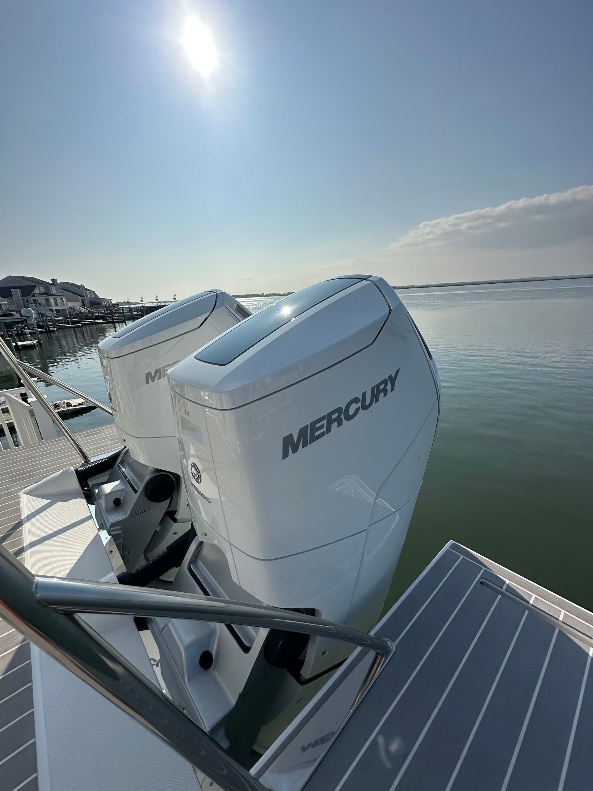 two mercury engines are on the back of a boat