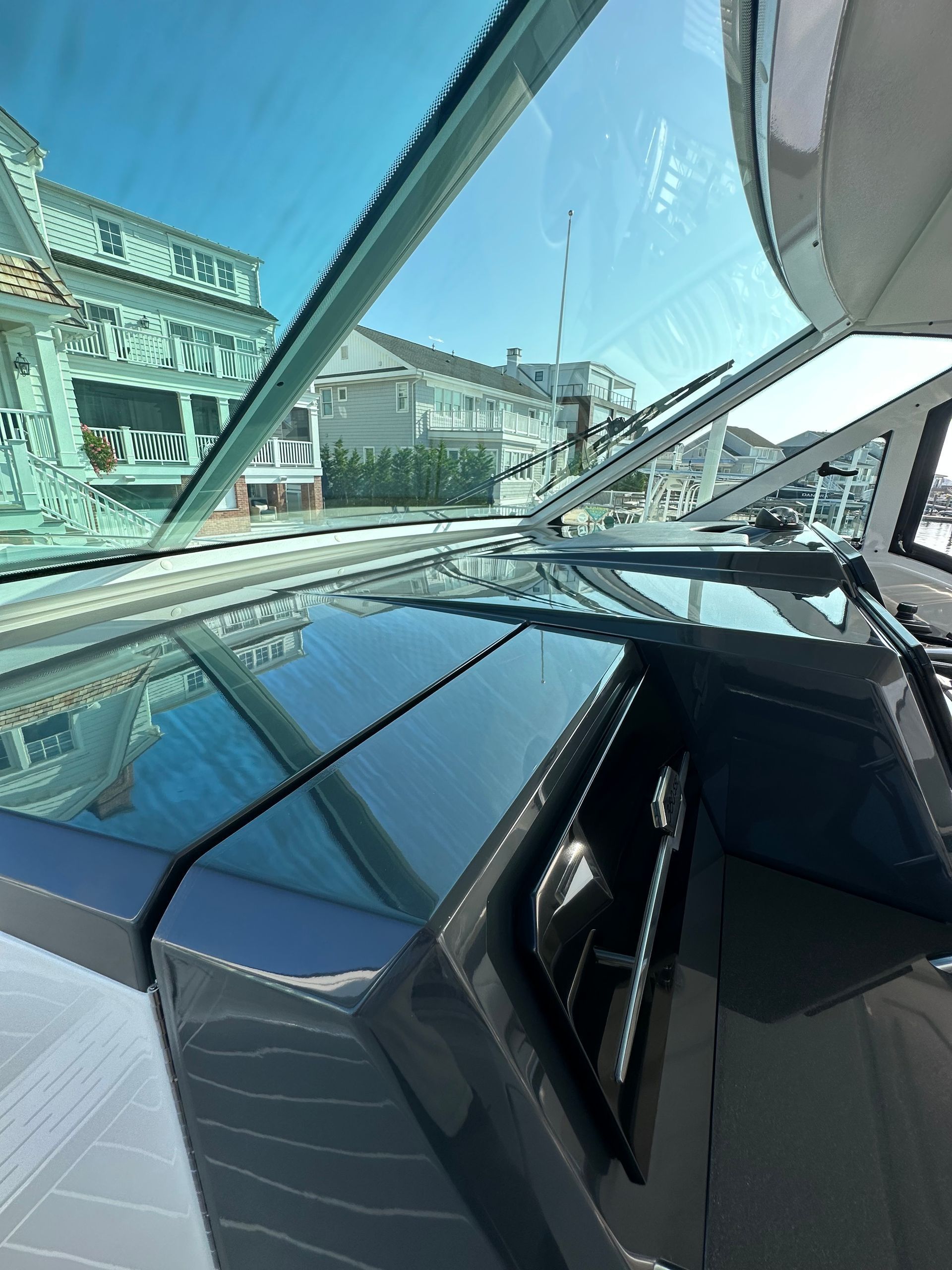 a boat with a view of a house through the window