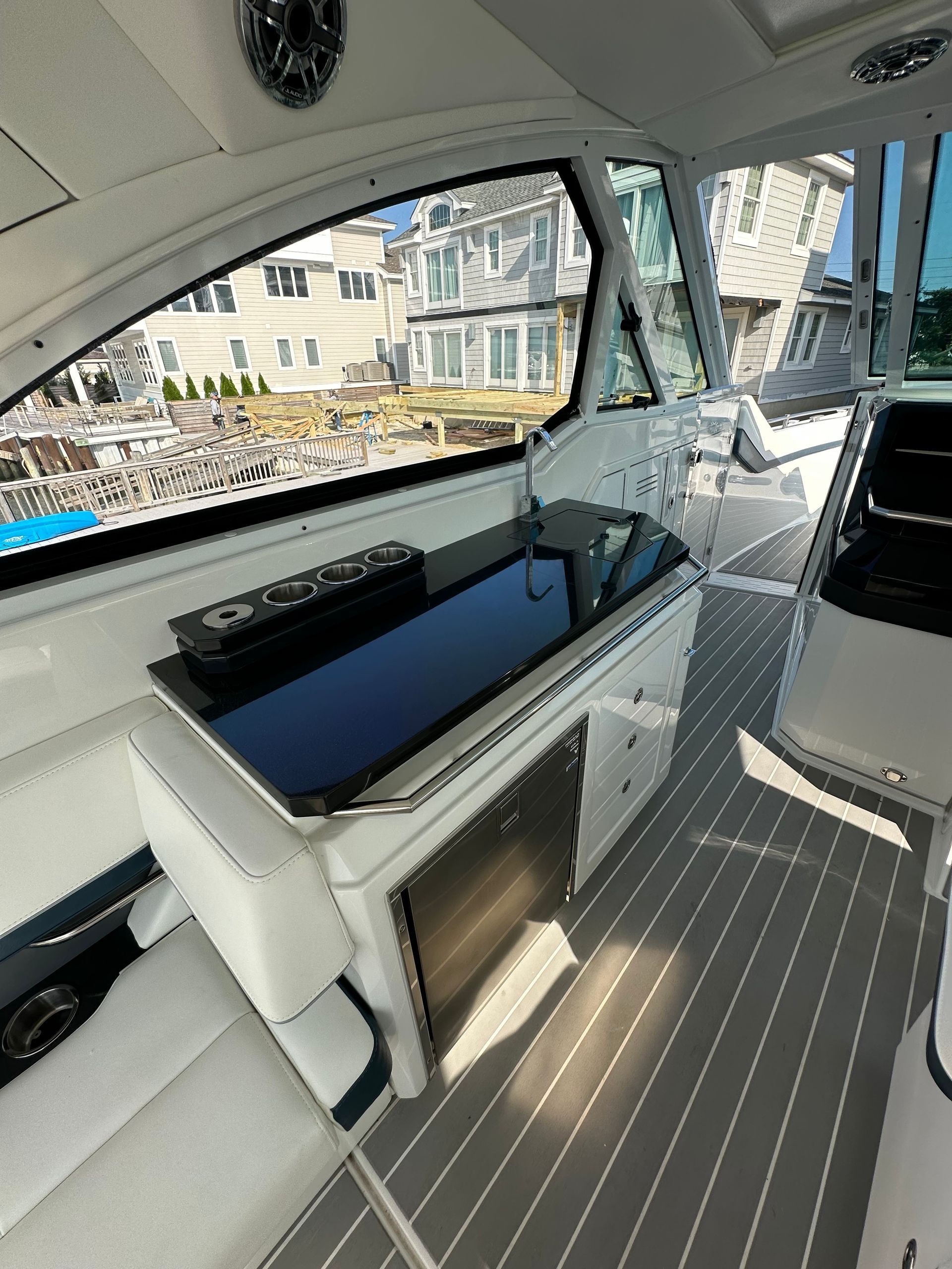 the inside of a boat with a black counter top