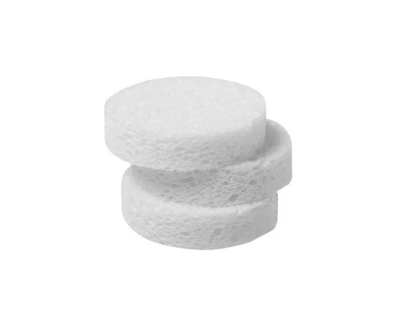 Three white sponges are stacked on top of each other on a white background.