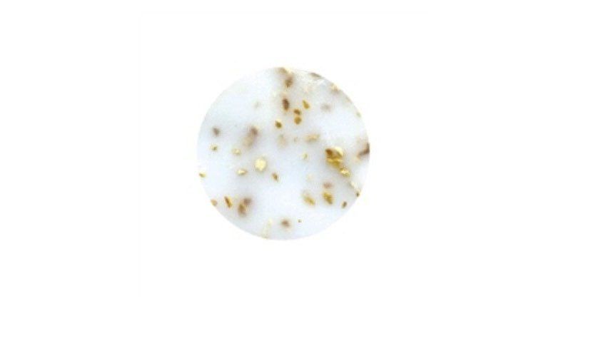 A white circle with gold spots on it on a white background.