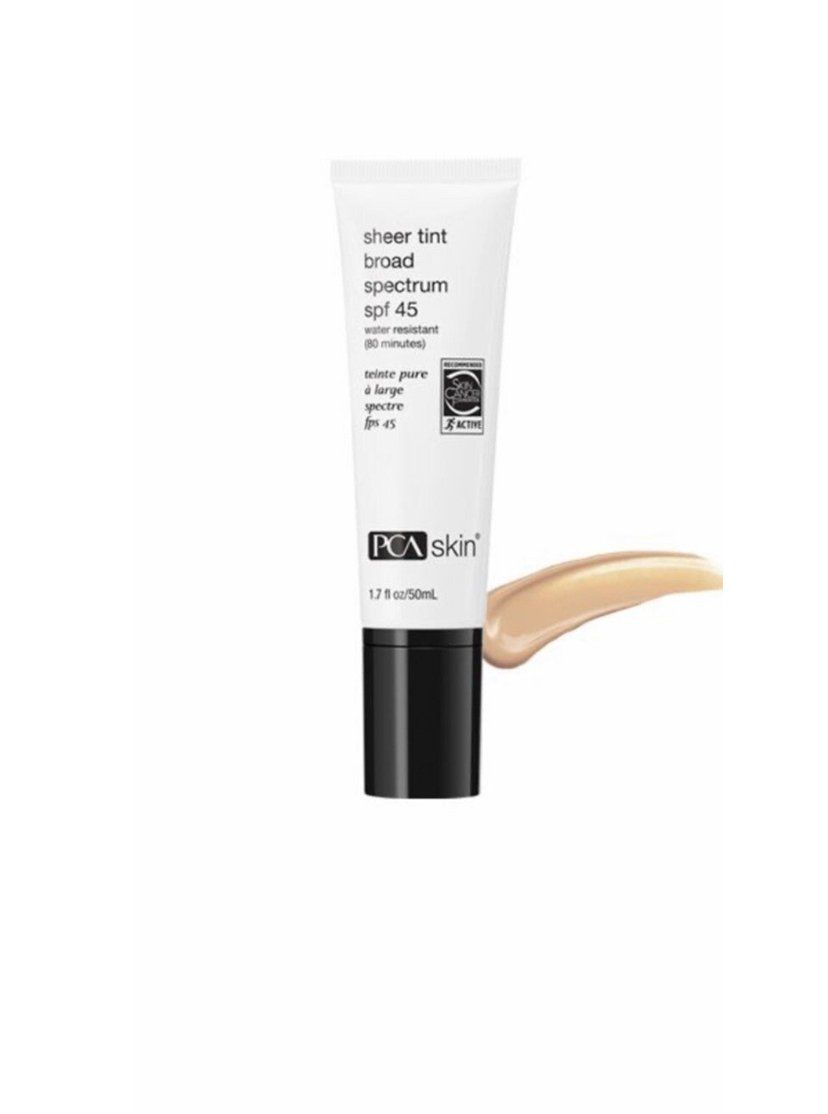A tube of foundation with a swatch of it on a white background.