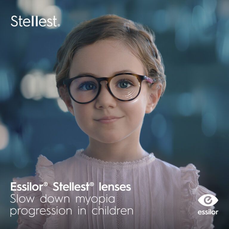 A child wearing glasses with the text Essilor Stellest lenses. Slow down myopia progression in children.