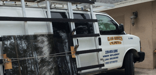 business' white van with glass materials for repair