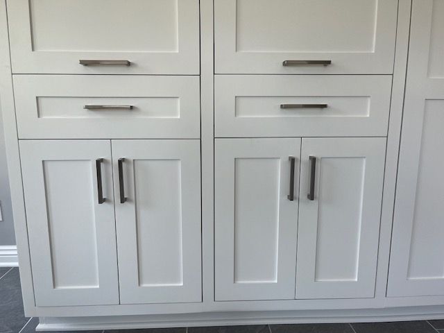 A cabinet with a lot of drawers and doors