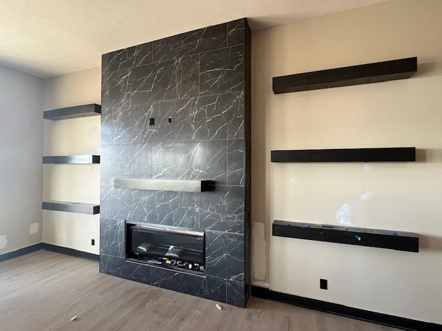 There is a fireplace in the middle of the room.