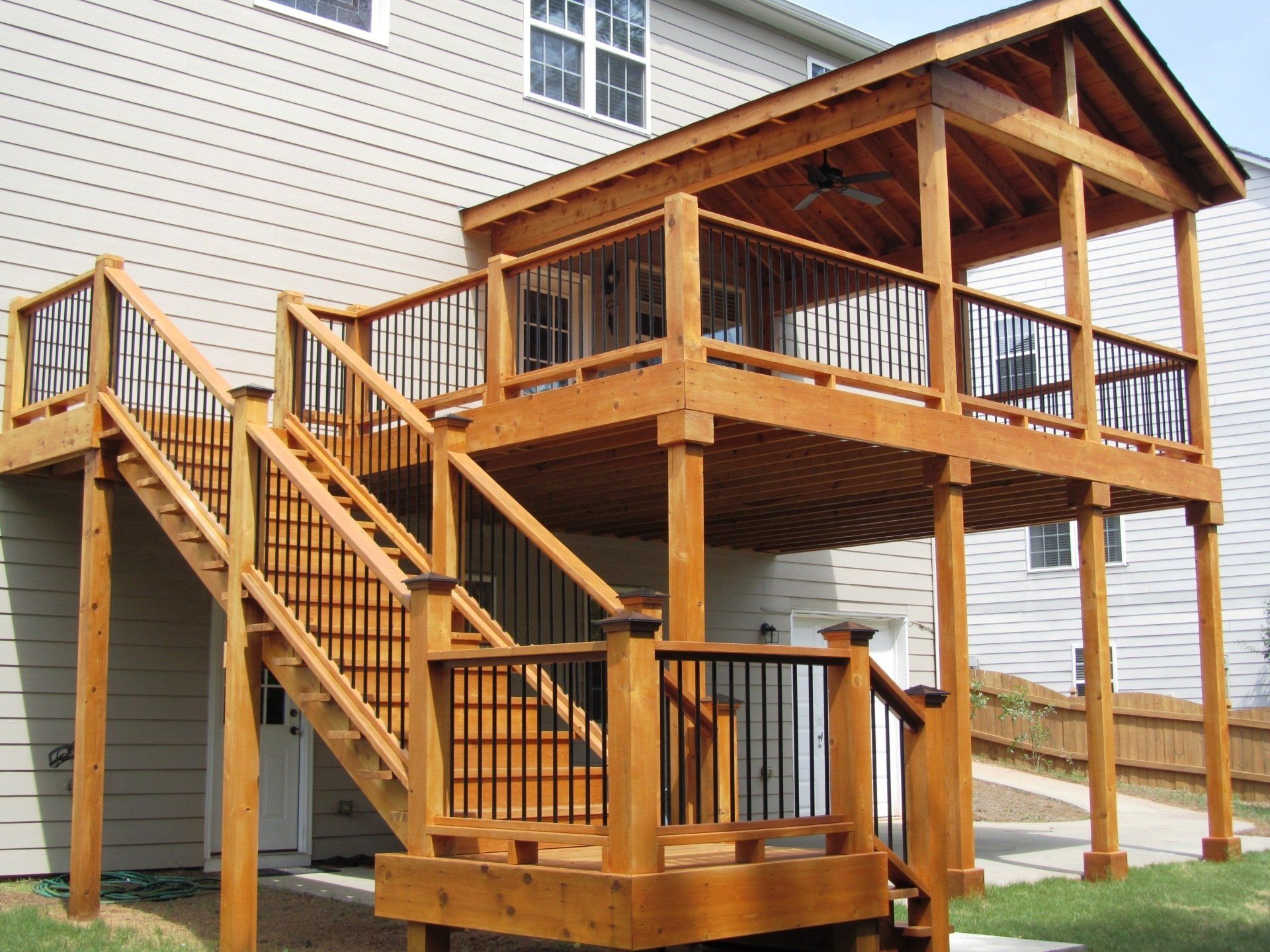 A large wooden deck with stairs leading up to it