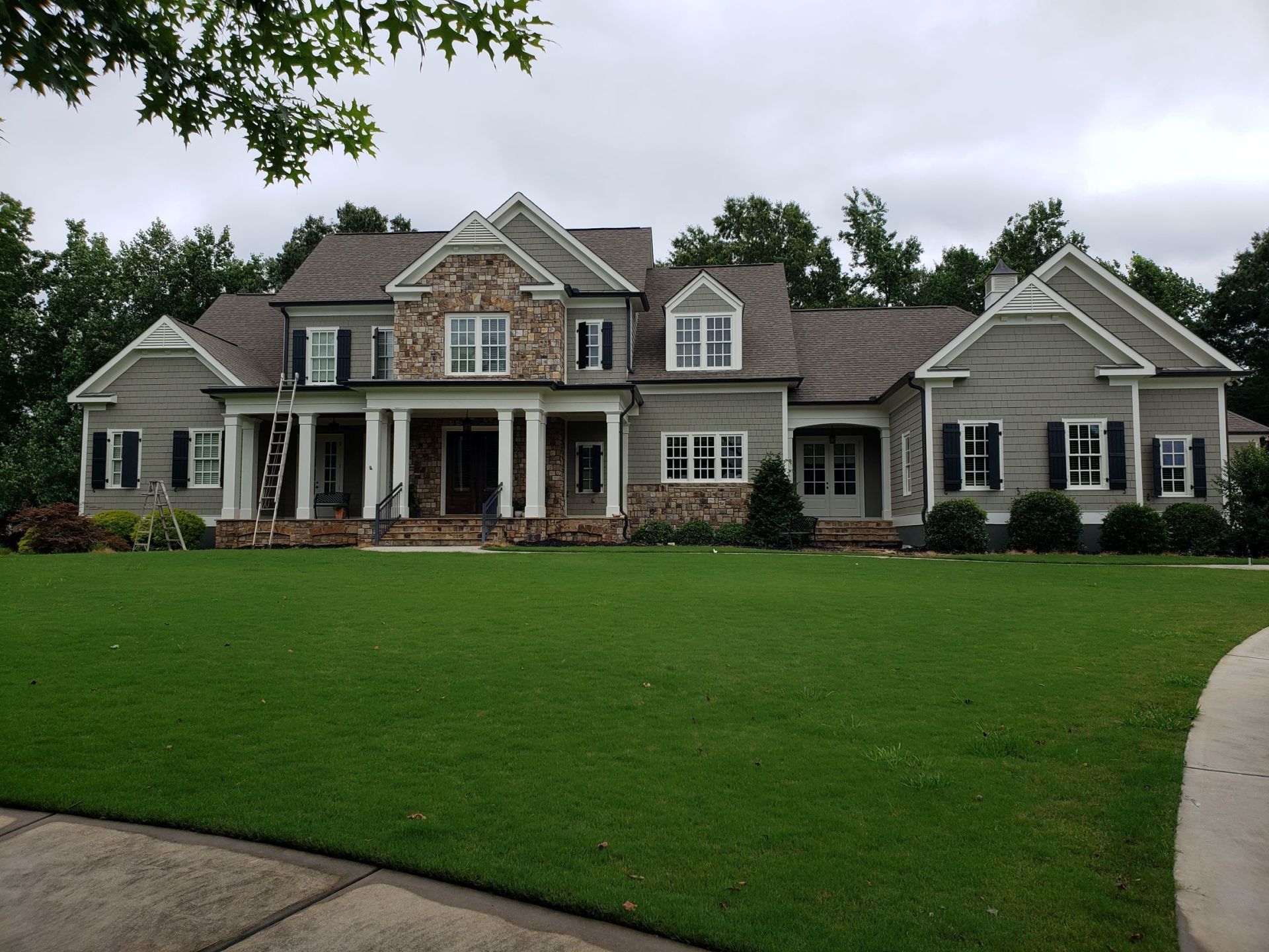 A large house with a large lawn in front of it
