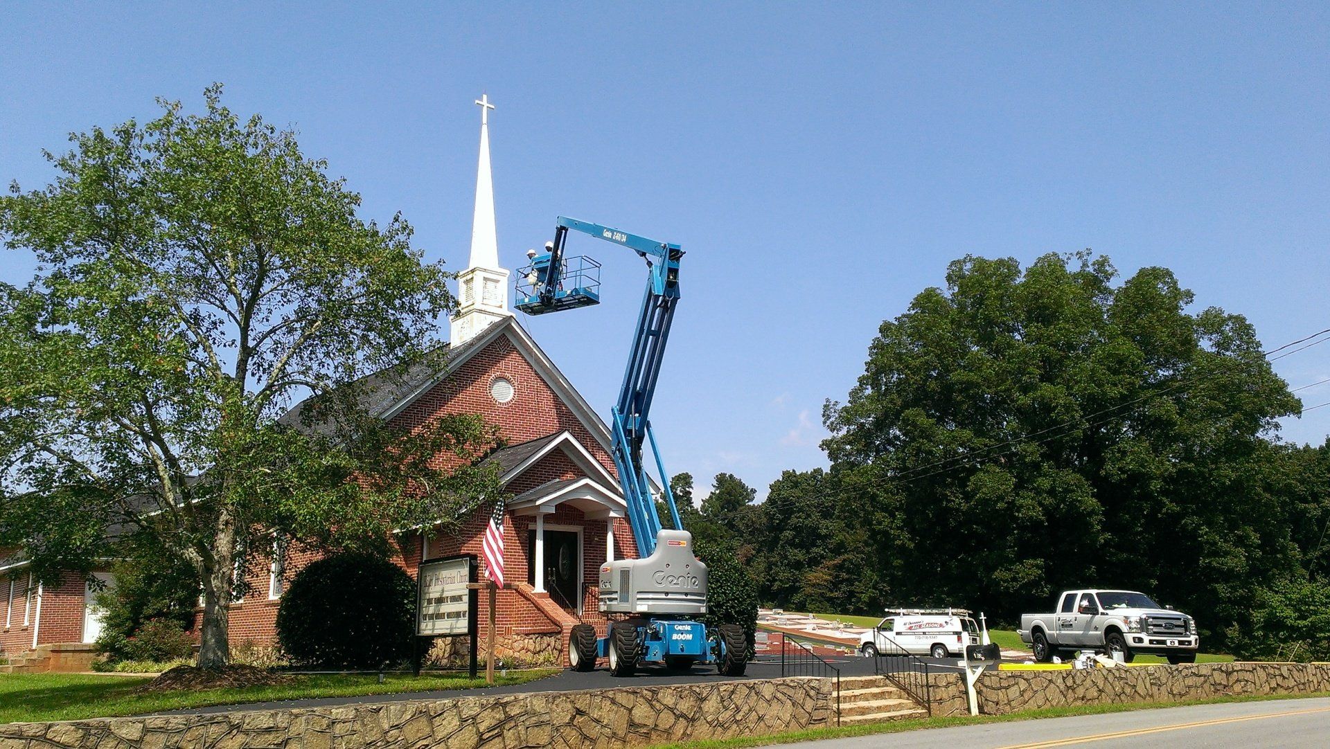 A church with a crane in front of it