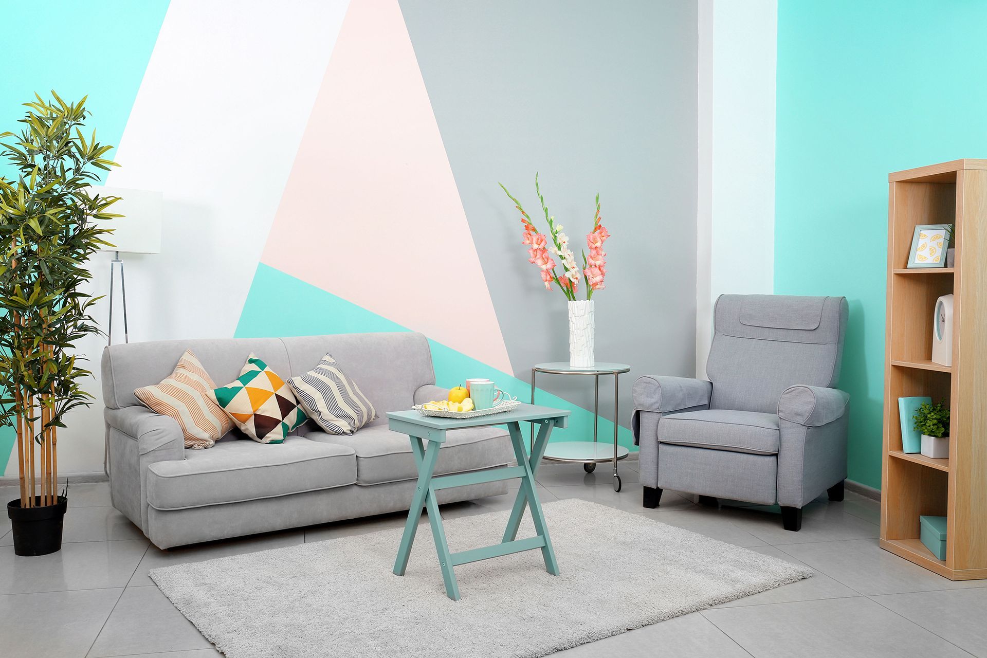 A living room with a couch, chair, table and rug