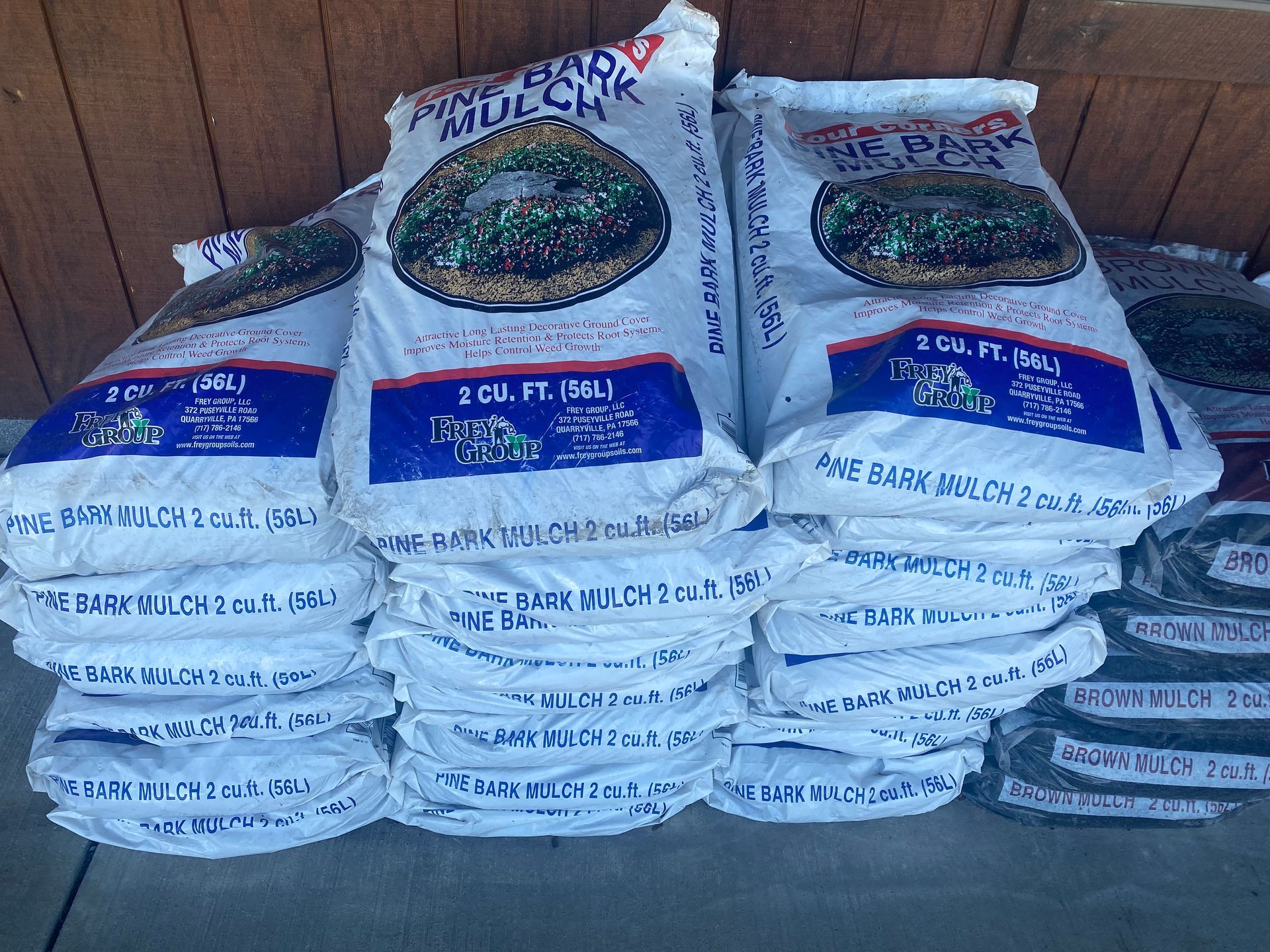 A bunch of bags of fertilizer are stacked on top of each other