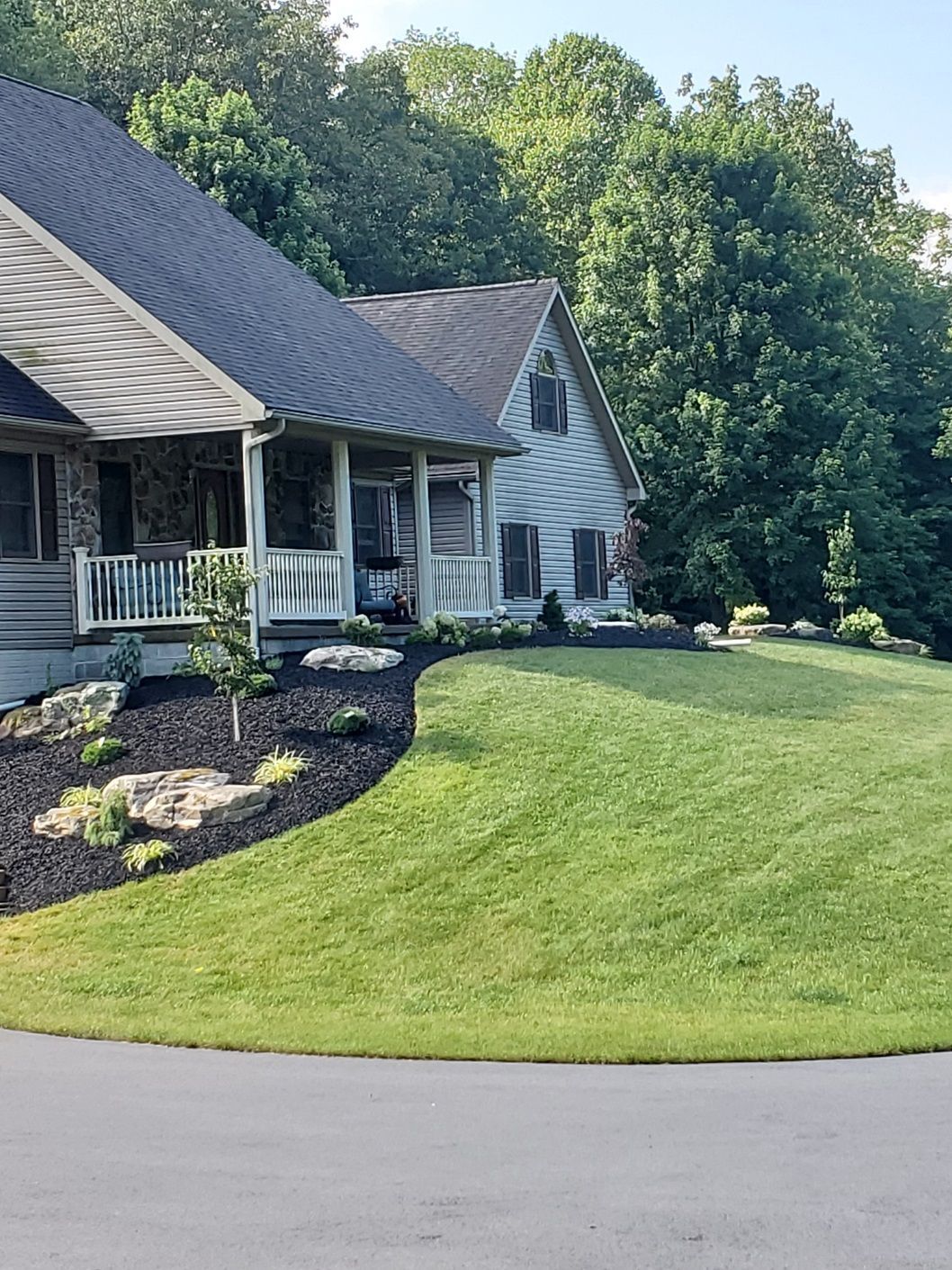 A house with a large lawn in front of it