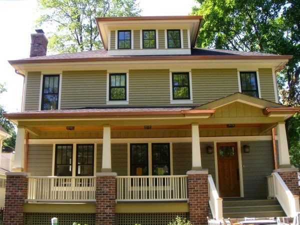 Two-story house with copper gutters.