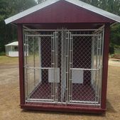 Small maroon double dog kennel with chain-link doors and a slanted roof outdoors