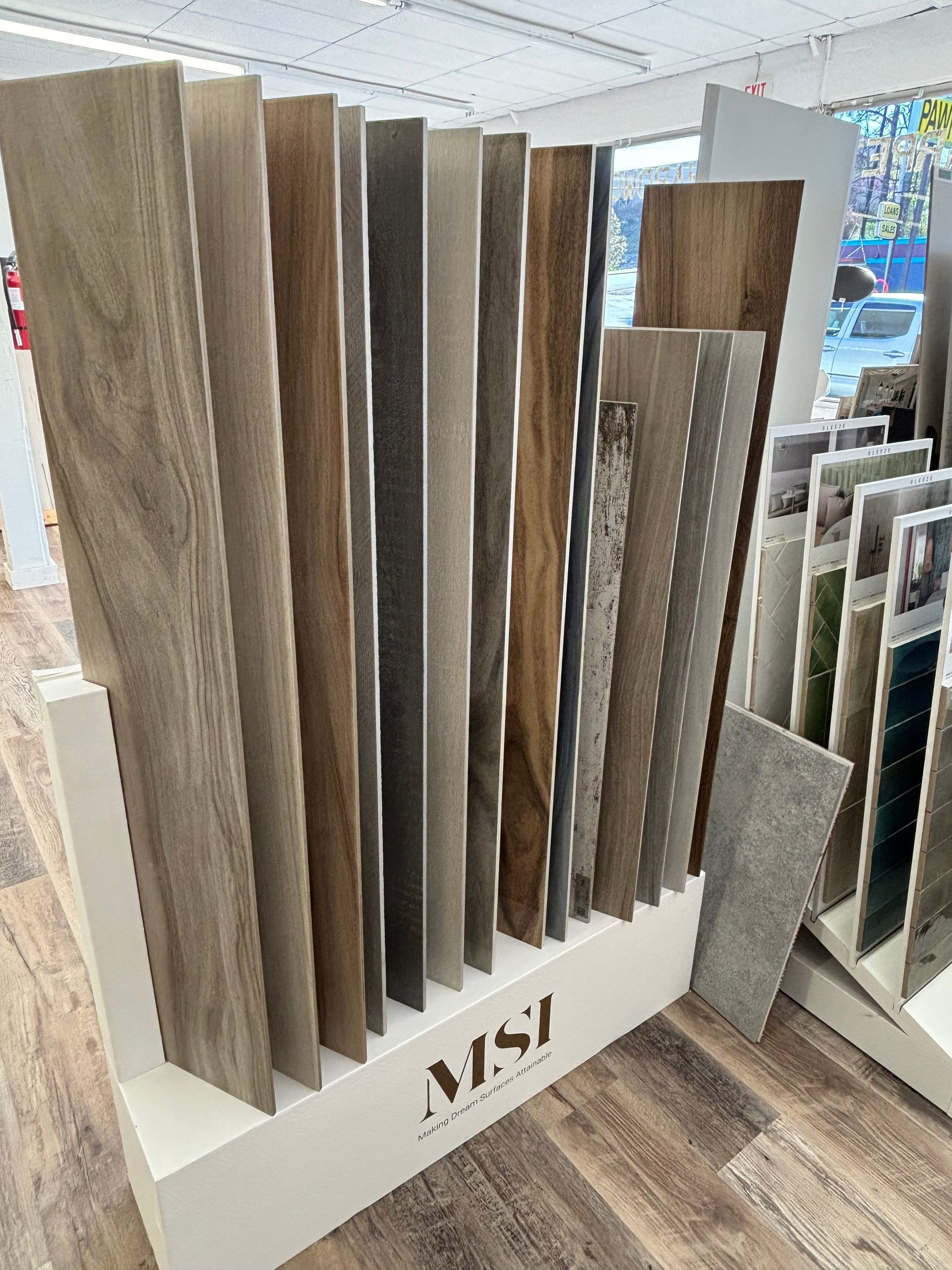 A display of wooden wood laminate flooring in a store.