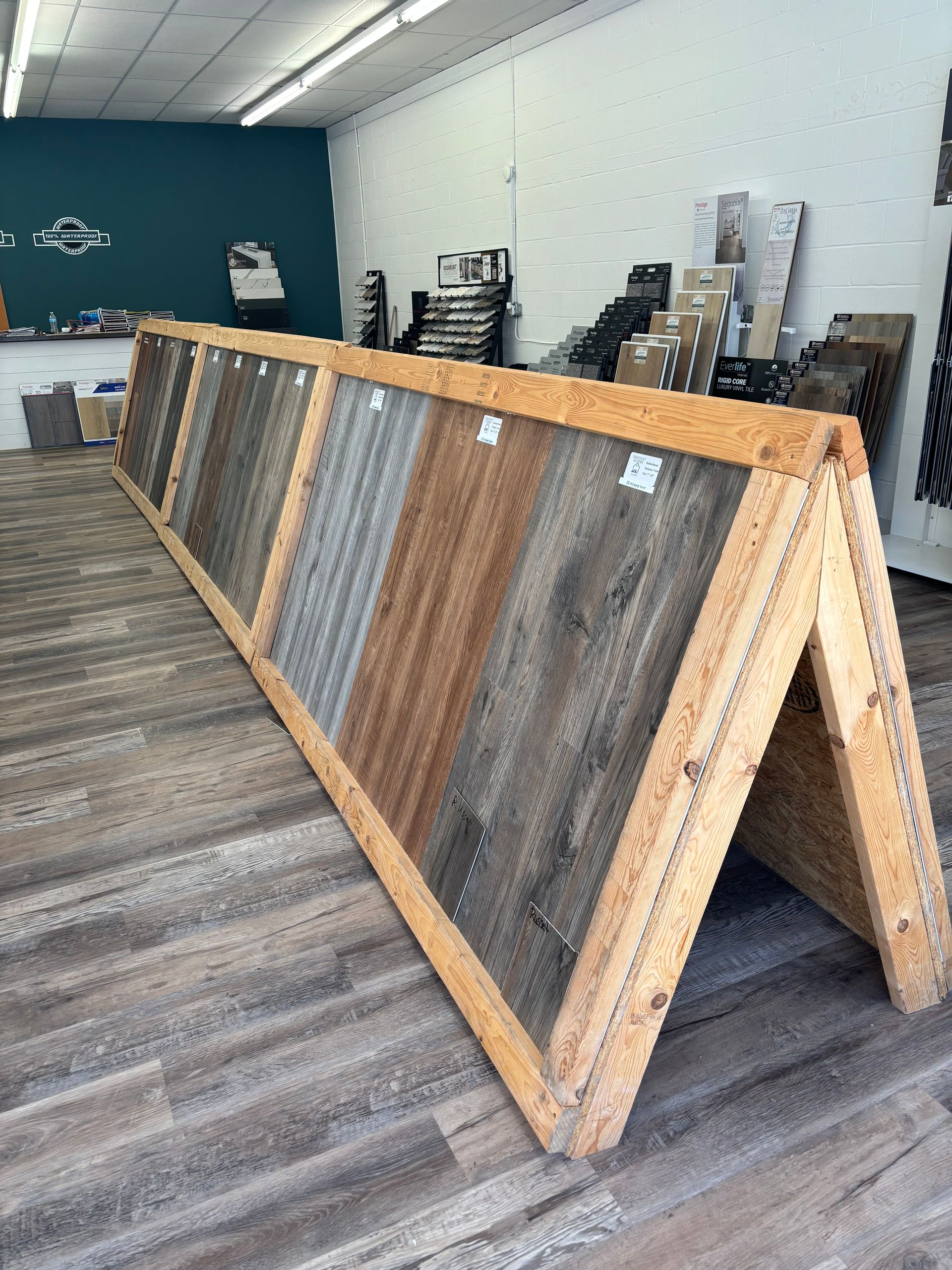 A display of wooden flooring samples in a store.