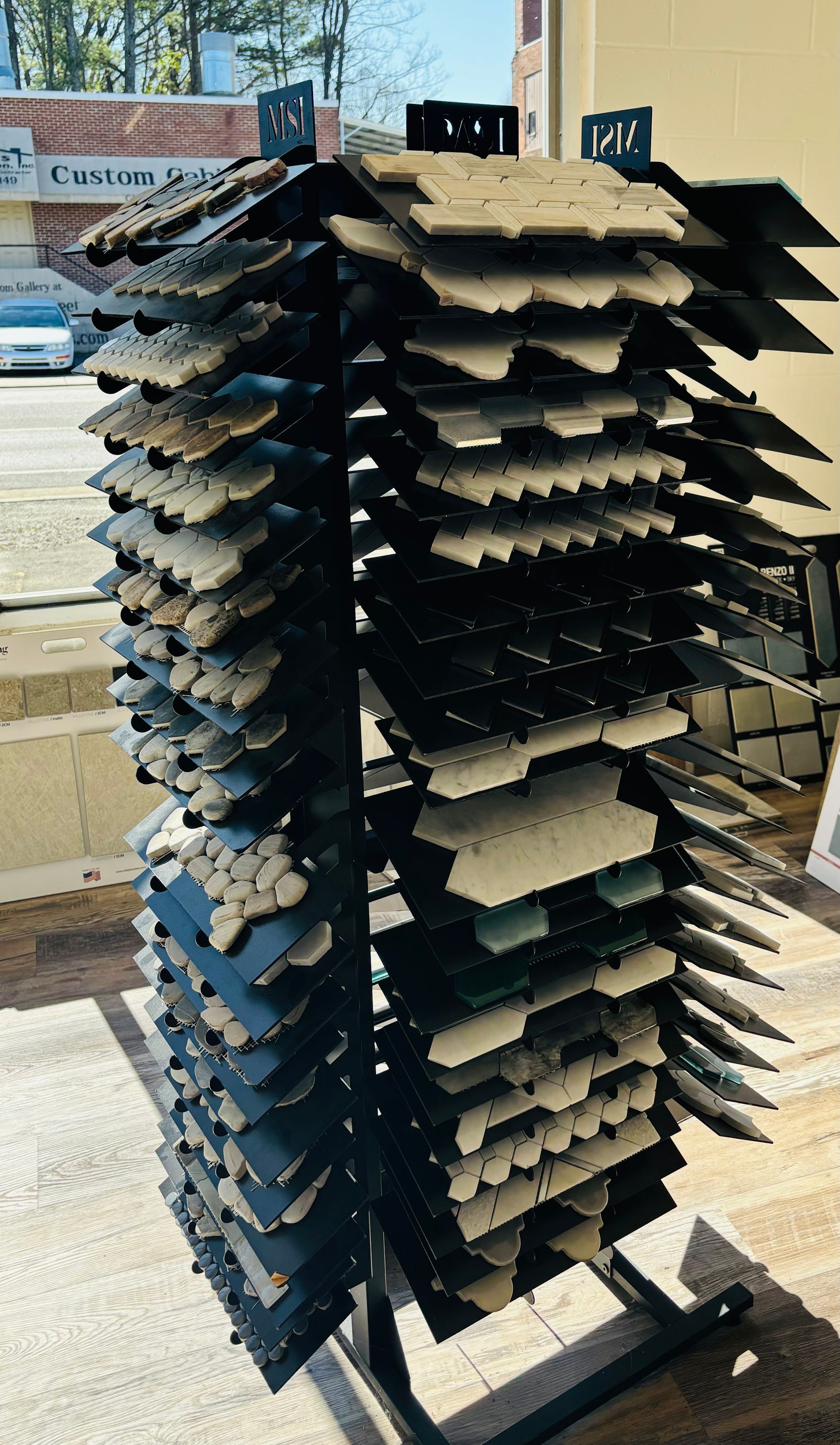 A display rack filled with lots of different types of tiles.