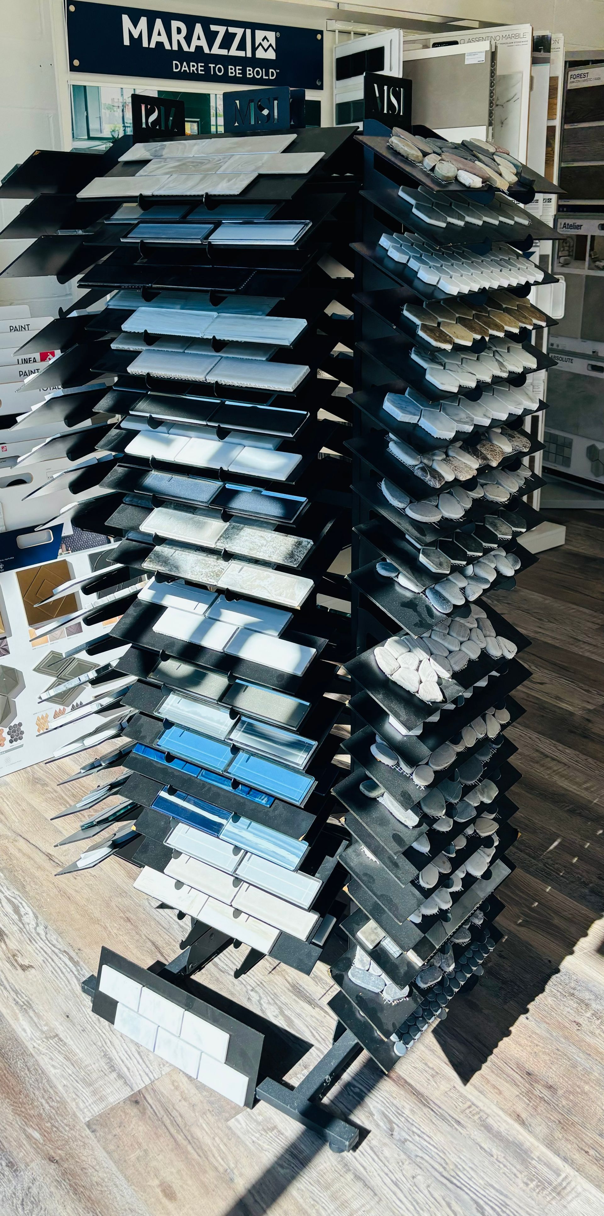 A display of tiles is stacked on top of each other in a store.