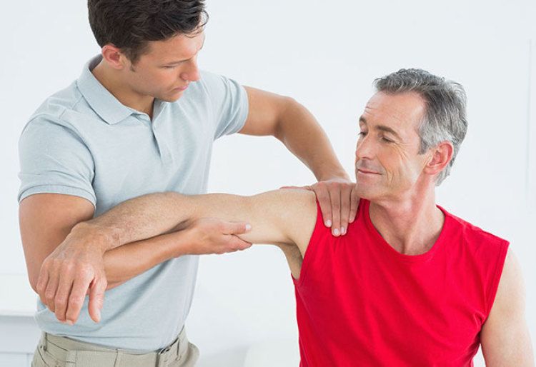 man receiving physical therapy