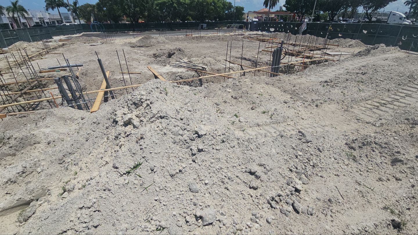 A large pile of dirt is sitting on top of a dirt field.