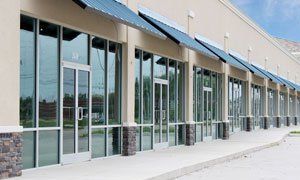 A large building with a lot of windows and awnings.
