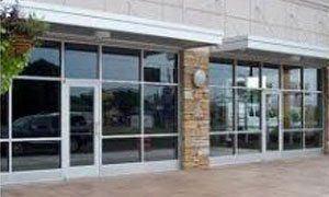 A large building with a lot of windows and doors.