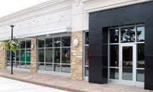 A large building with a lot of windows and doors.