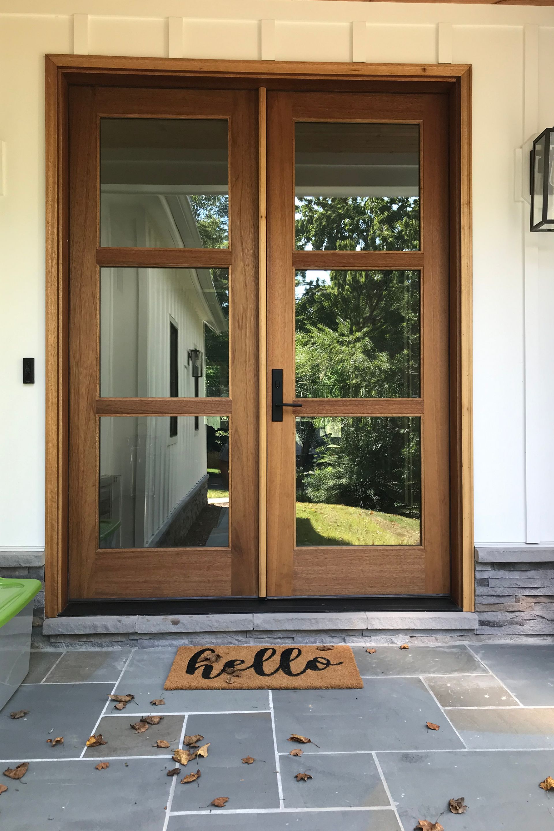 A door with a welcome mat in front of it.