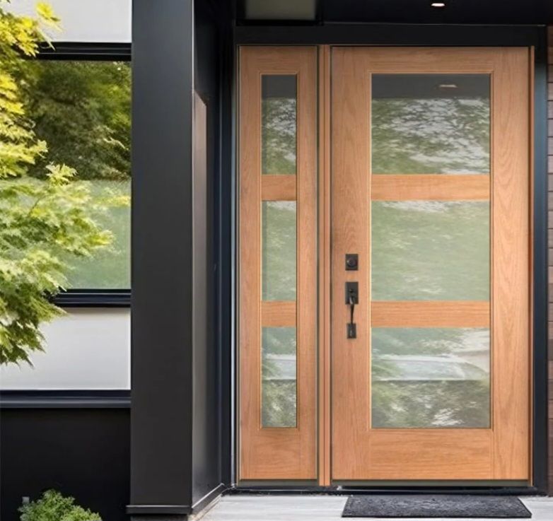 A wooden door with glass panels and a black handle