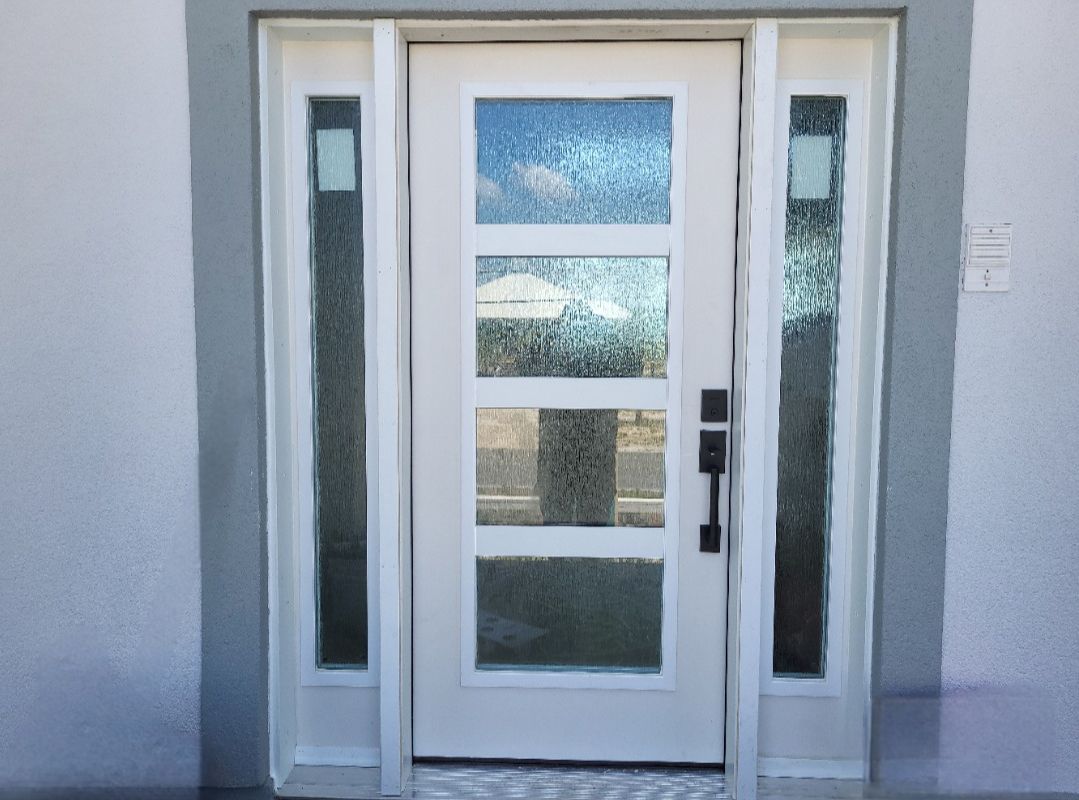 A white door with a lot of windows on it