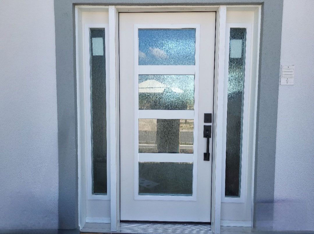 A white door with a lot of windows on it