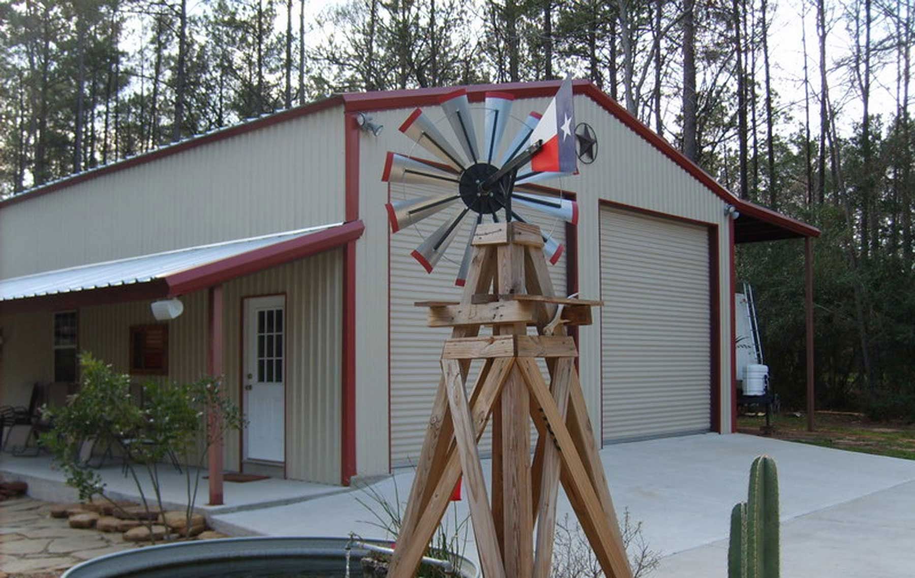 A house with a windmill in front of it