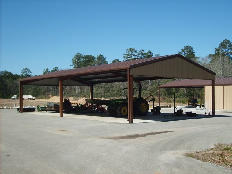 A tractor is parked under a roof