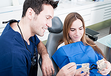 Dentist talking to a patient